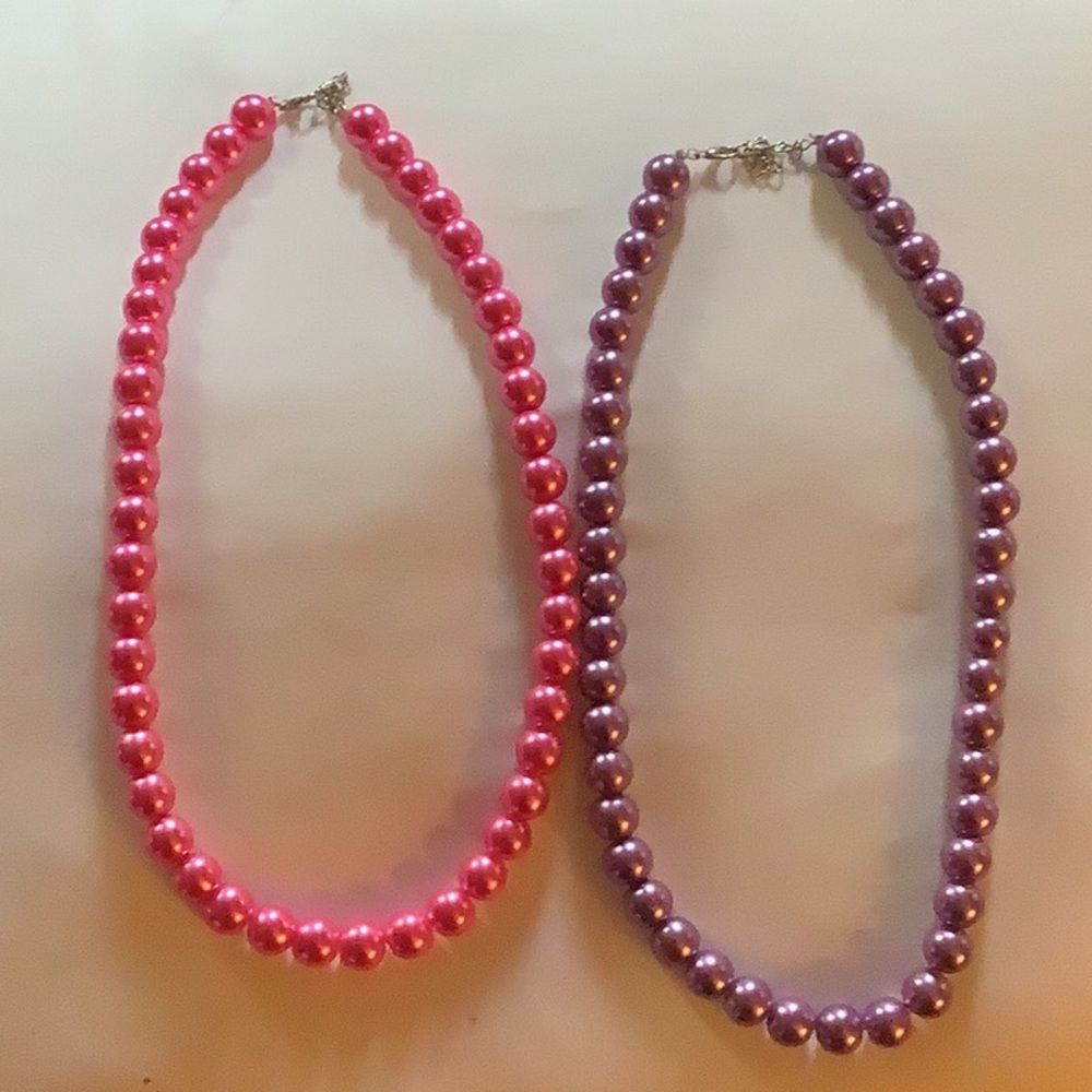 2 beautiful beaded necklaces 20 “  1 purple 1 pink. $20.00 each 2 for $35.00